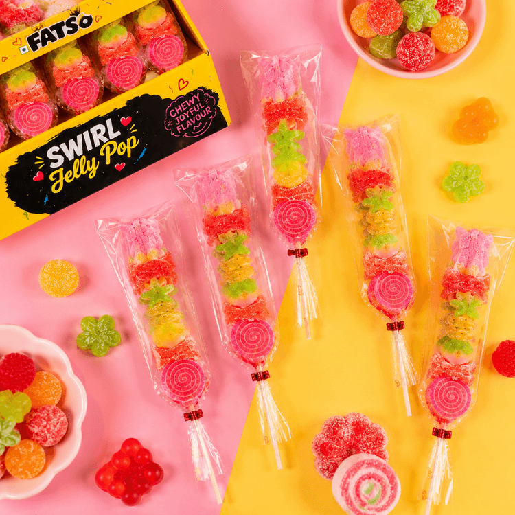 Fatso swirl jelly sticks in pink packaging on a fruity set
