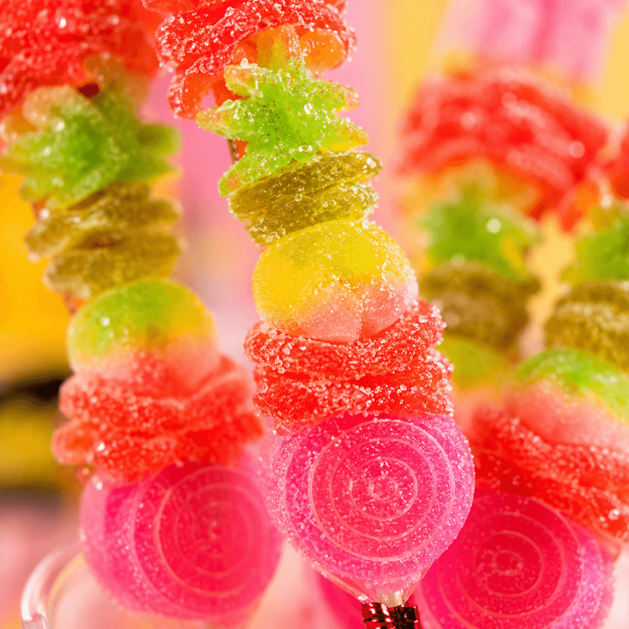 Fatso jelly pops in vivid red, green, and yellow fruit colours